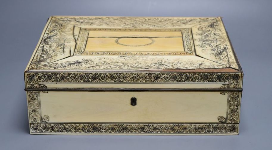 A Vizagapatam ivory sewing box, early 19th century, with interior fittings, 31cm wide